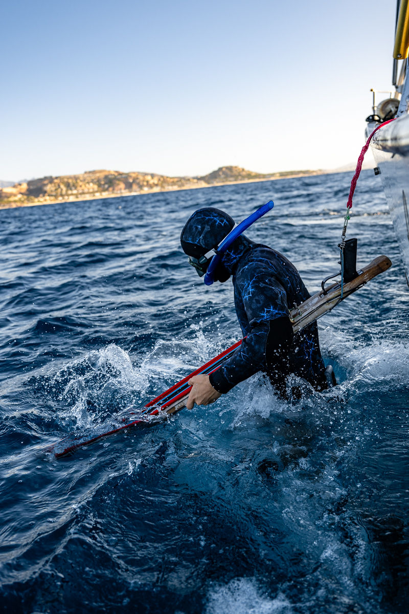 Spearfisher climbing back onto the Intrepid boat